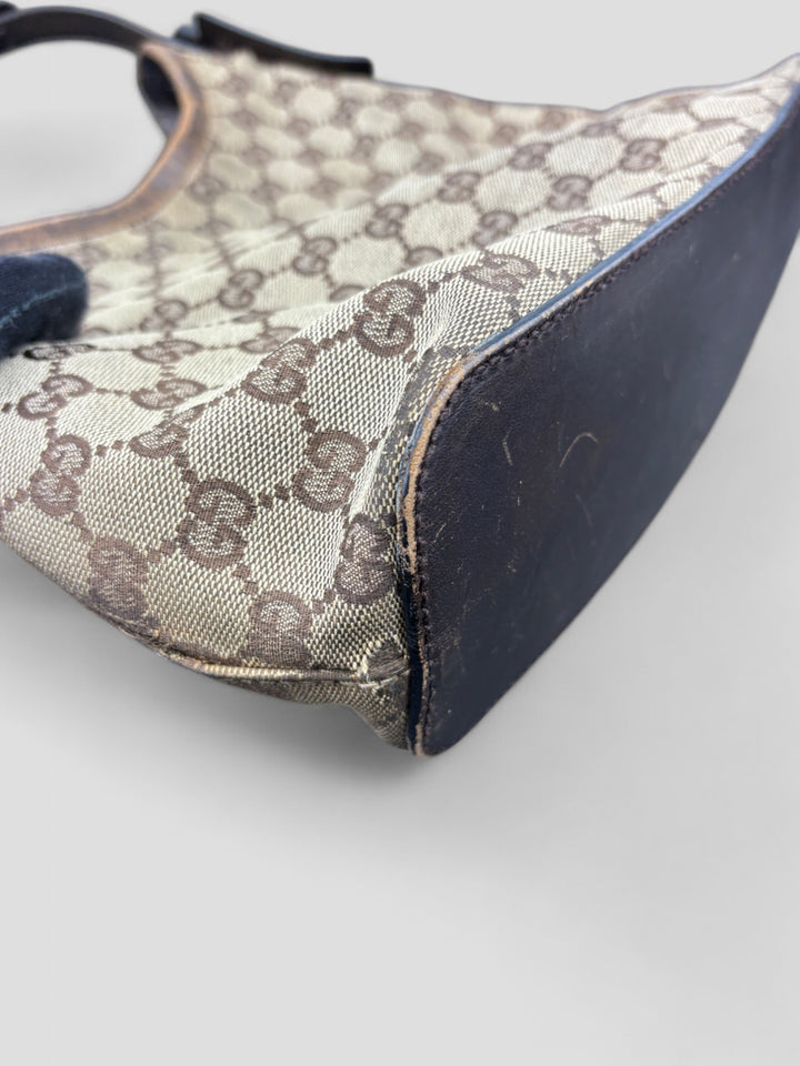 Gucci Hobo Tasche aus Monogramm-Canvas mit Holzapplikationen, eleganten Lederriemen und stilvollem Design