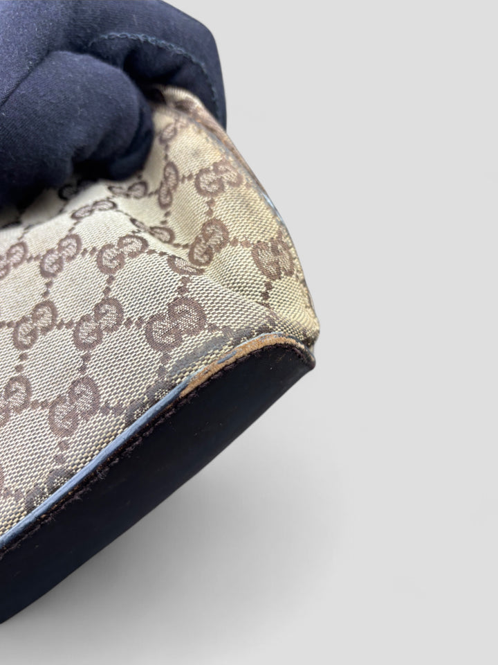 Gucci Hobo Tasche aus Monogramm-Canvas mit Holzapplikationen, eleganten Lederriemen und stilvollem Design
