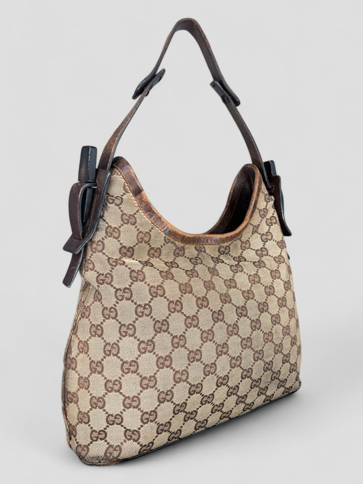 Gucci Hobo Tasche aus Monogramm-Canvas mit Holzapplikationen, eleganten Lederriemen und stilvollem Design