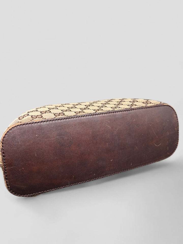 Gucci Hobo Tasche aus Monogramm-Canvas mit Holzapplikationen, eleganten Lederriemen und stilvollem Design