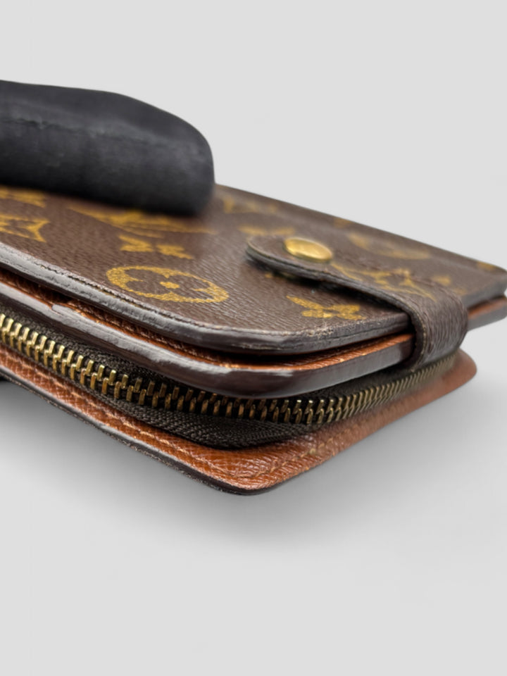 Louis Vuitton Compact Zip Portemonnaie in Monogram Canvas mit Reißverschluss, Druckknopf und durchdachter Innenaufteilung für Karten, Münzen und Geldscheine