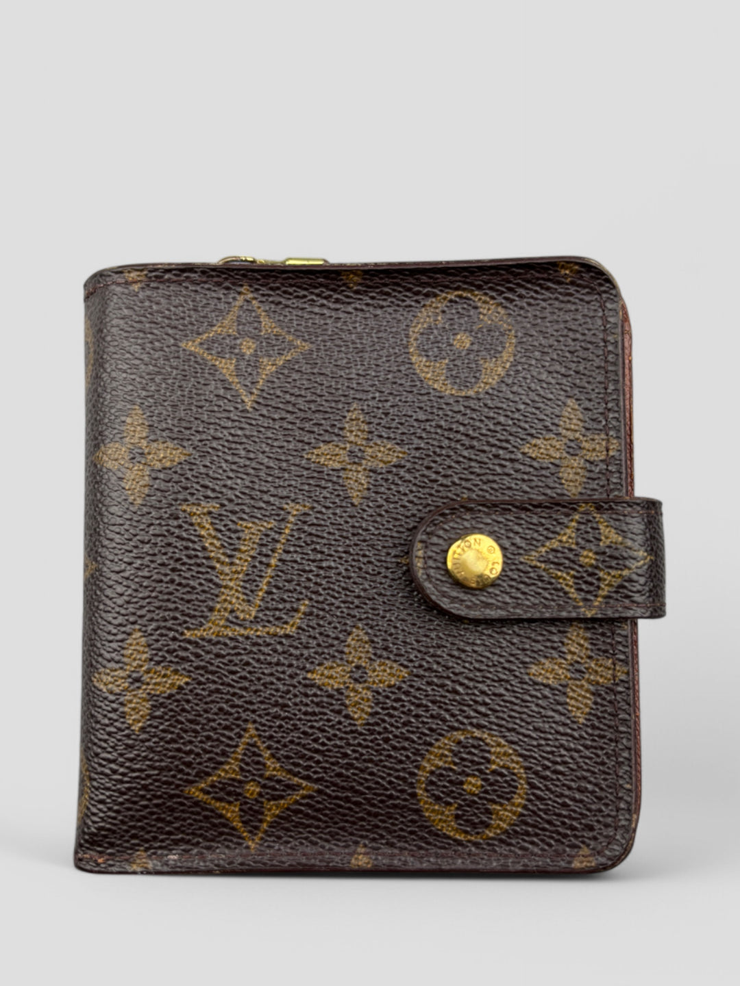 Louis Vuitton Geldbeutel im ikonischen Monogram Canvas mit Druckknopflasche und durchdachtem Innenraum für Karten und Münzen
