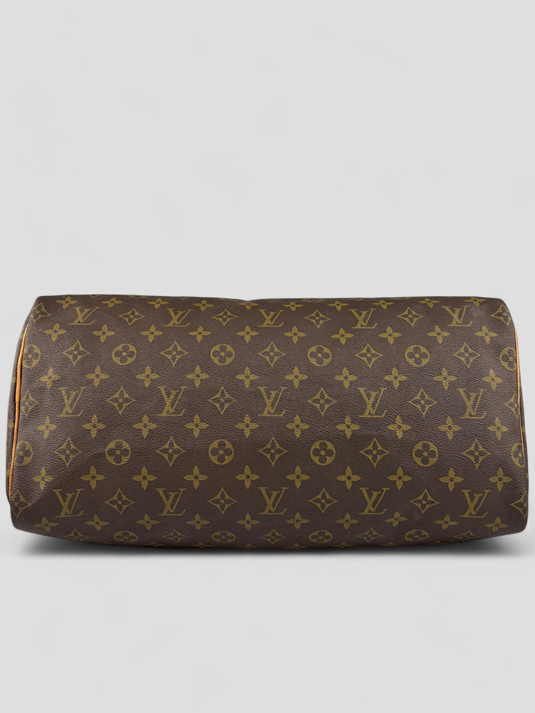 Louis Vuitton Speedy Reisetasche aus Monogramm-Canvas in Braun mit goldfarbenen Beschlägen und Lederdetails. Geräumig und stilvoll