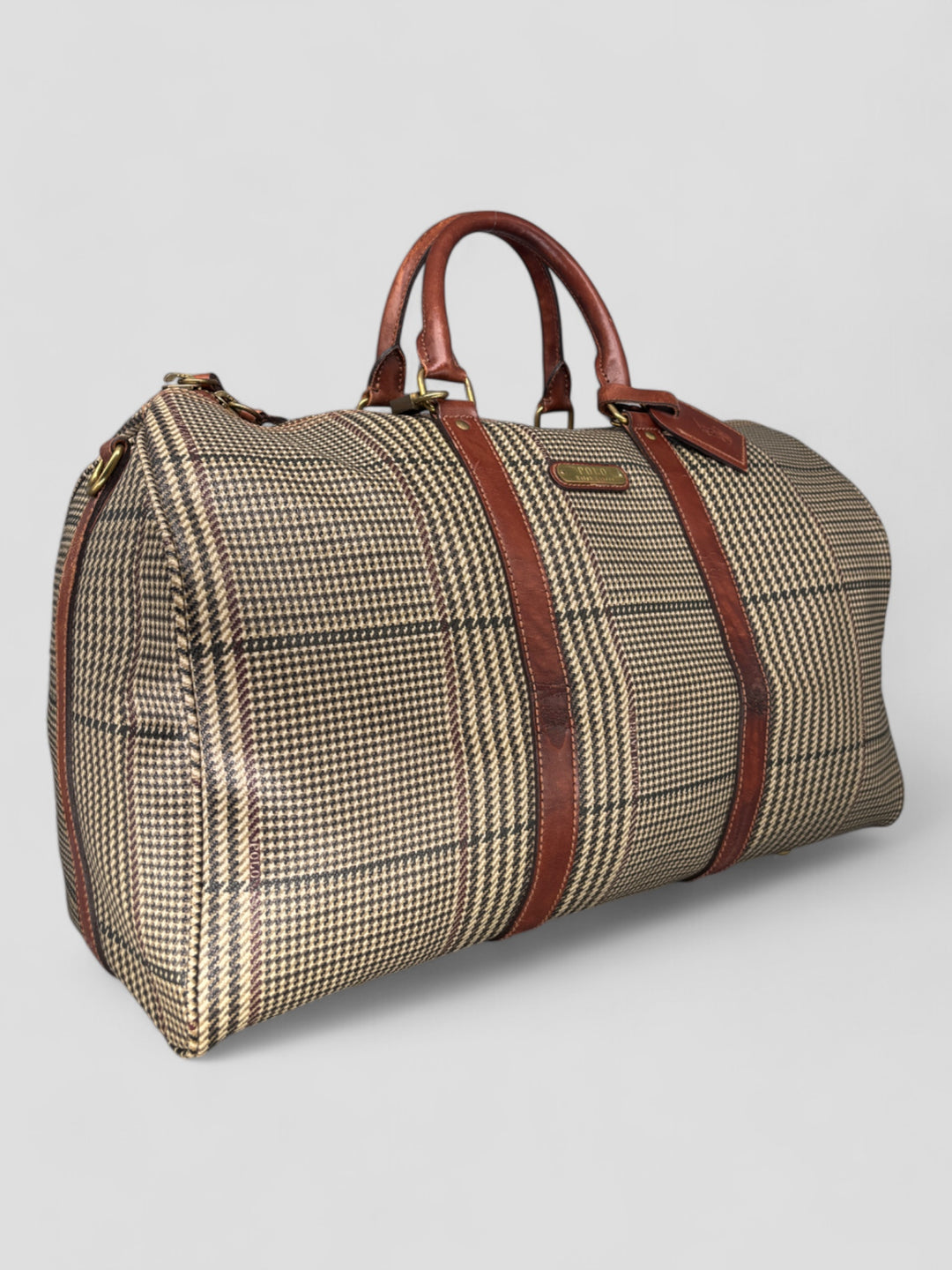 Ralph Lauren Reisetasche mit klassischem Karomuster, braunen Lederdetails und goldfarbenen Akzenten