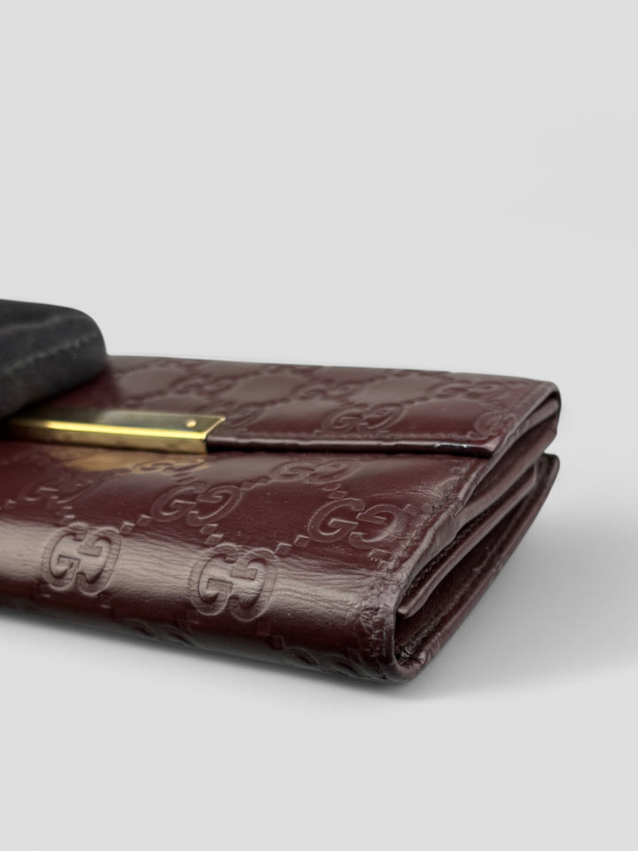 Vintage Gucci Unisex Leder Geldbeutel Braun Monogram Goldene Akzente, Second-Hand Gucci Wallet Brown Monogram Gold Details