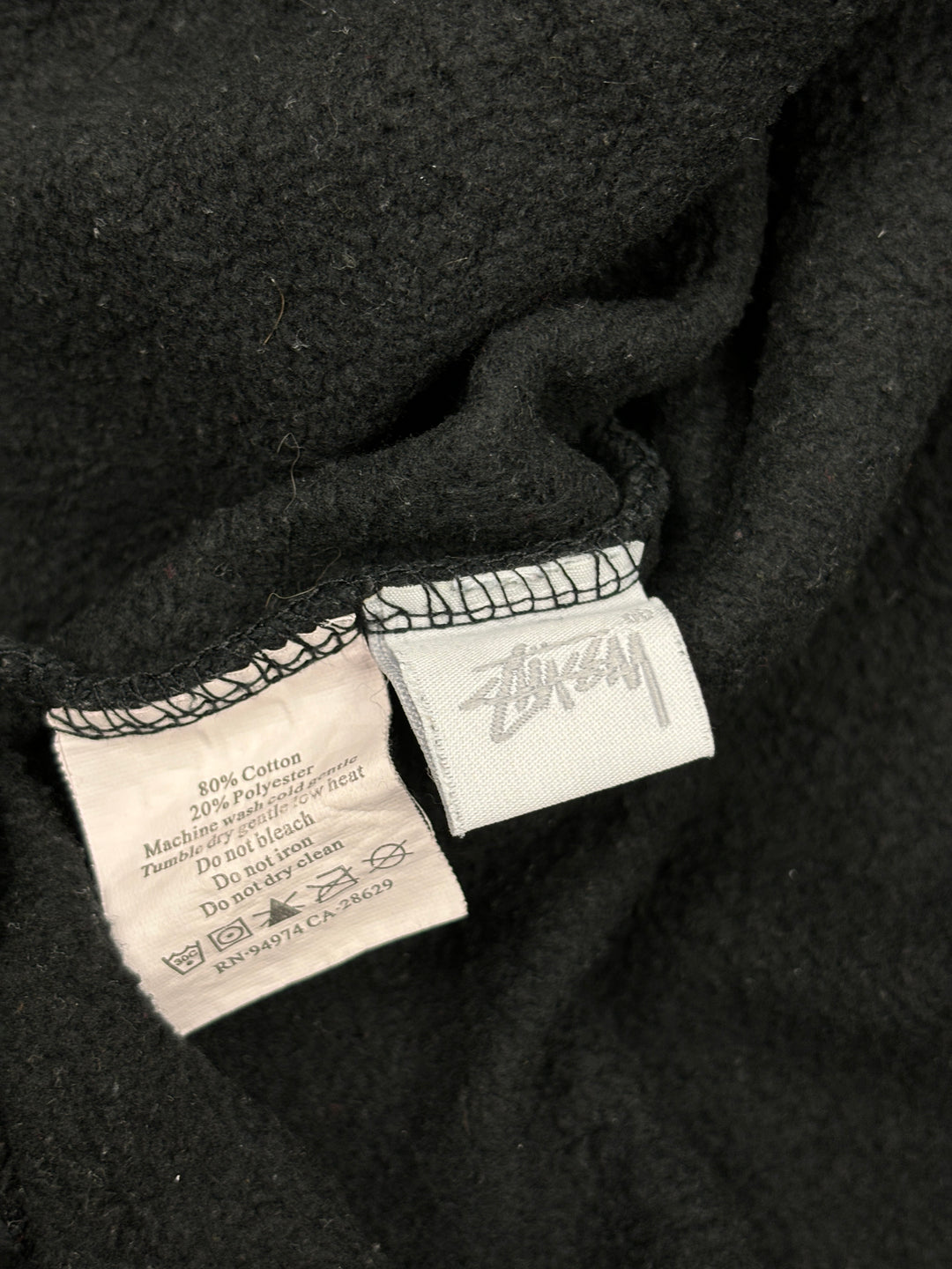vintage Stussy Pullover fuer Herren in schwarz, second hand stussy sweater men in black
